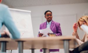 african-american-businesswoman-holding-a-presentat-2023-11-27-05-06-19-utc.jpg